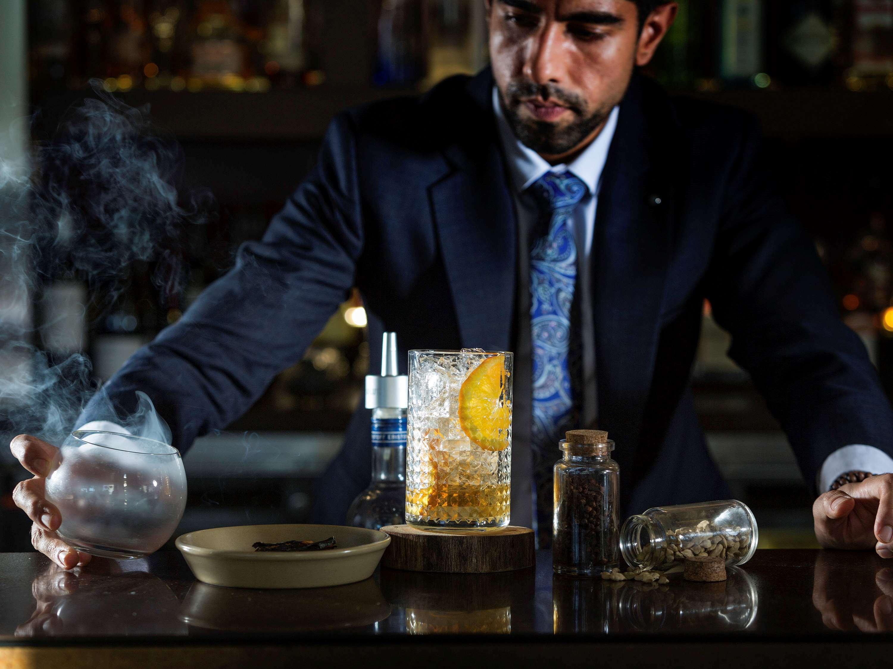 Pullman Sydney Olympic Park Hotel Exterior photo A bartender at work