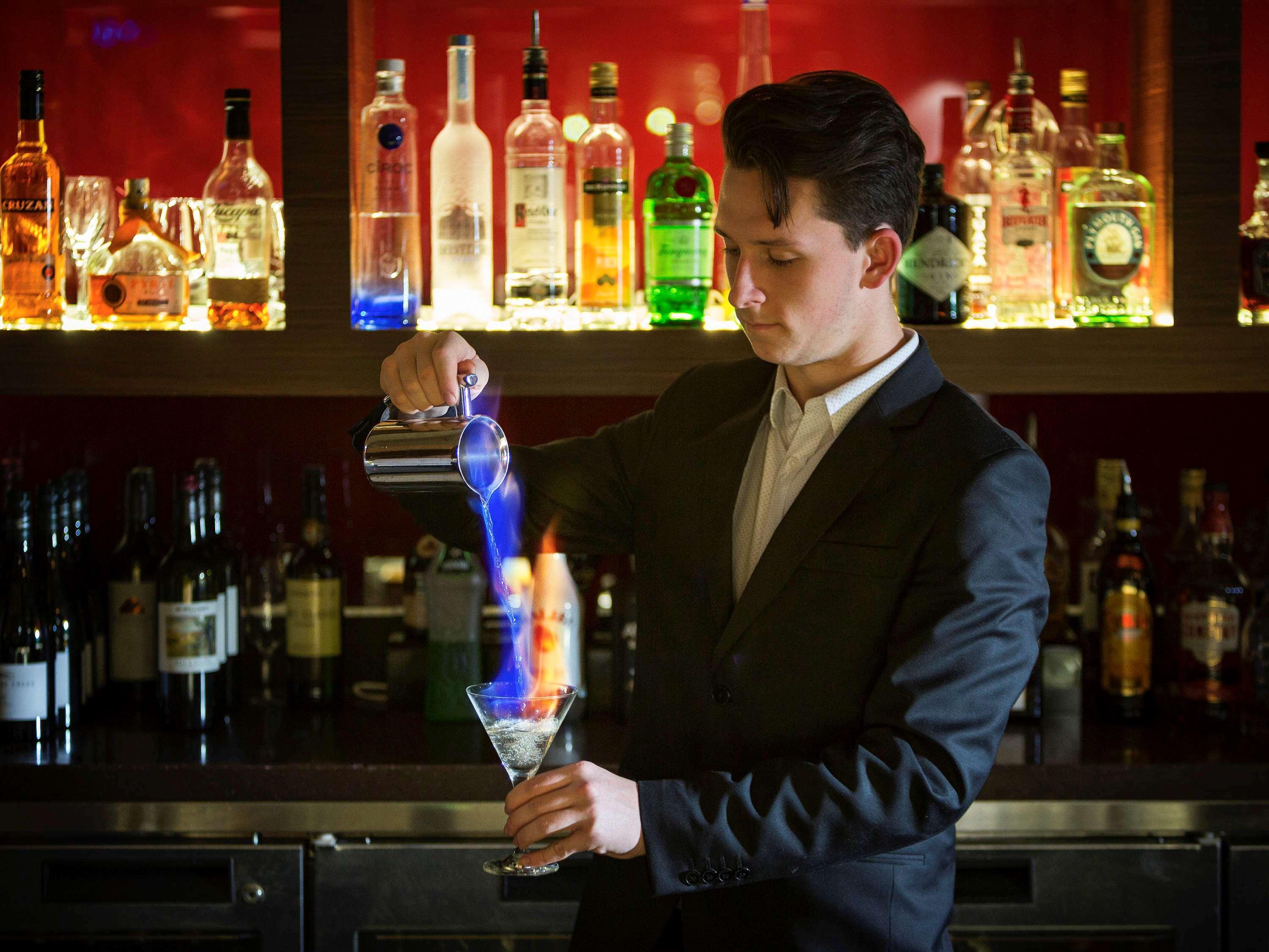 Pullman Sydney Olympic Park Hotel Exterior photo A bartender at work