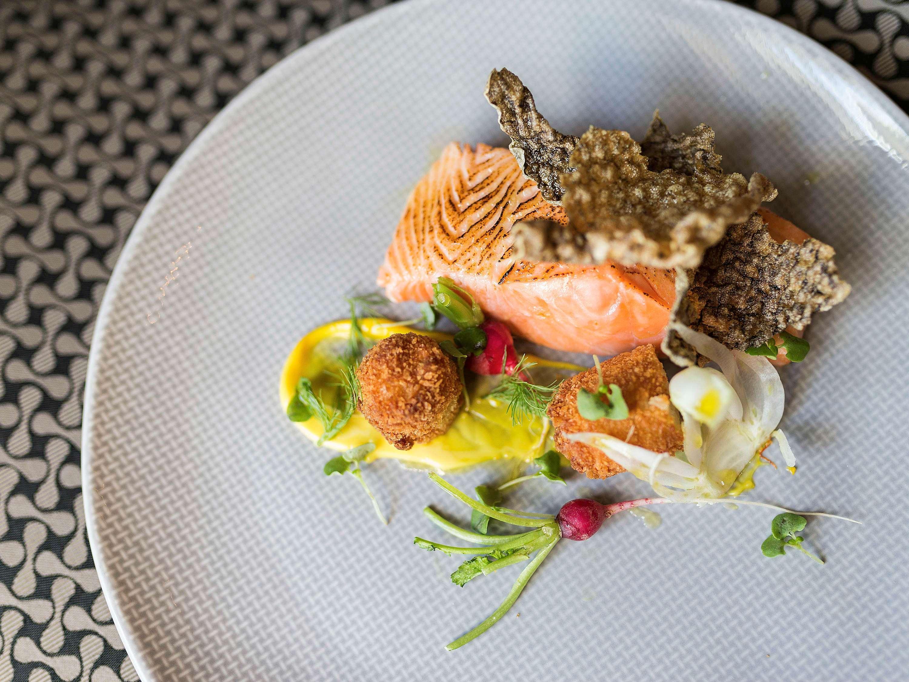 Pullman Sydney Olympic Park Hotel Exterior photo Salmon prepared with a sauce of white wine, mustard, and cream