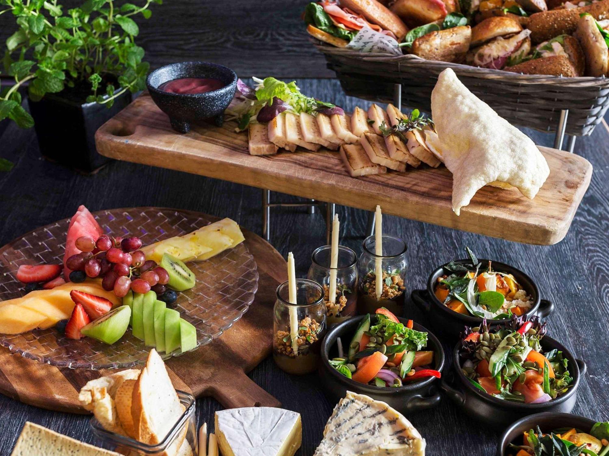 Pullman Sydney Olympic Park Hotel Exterior photo A selection of tapas