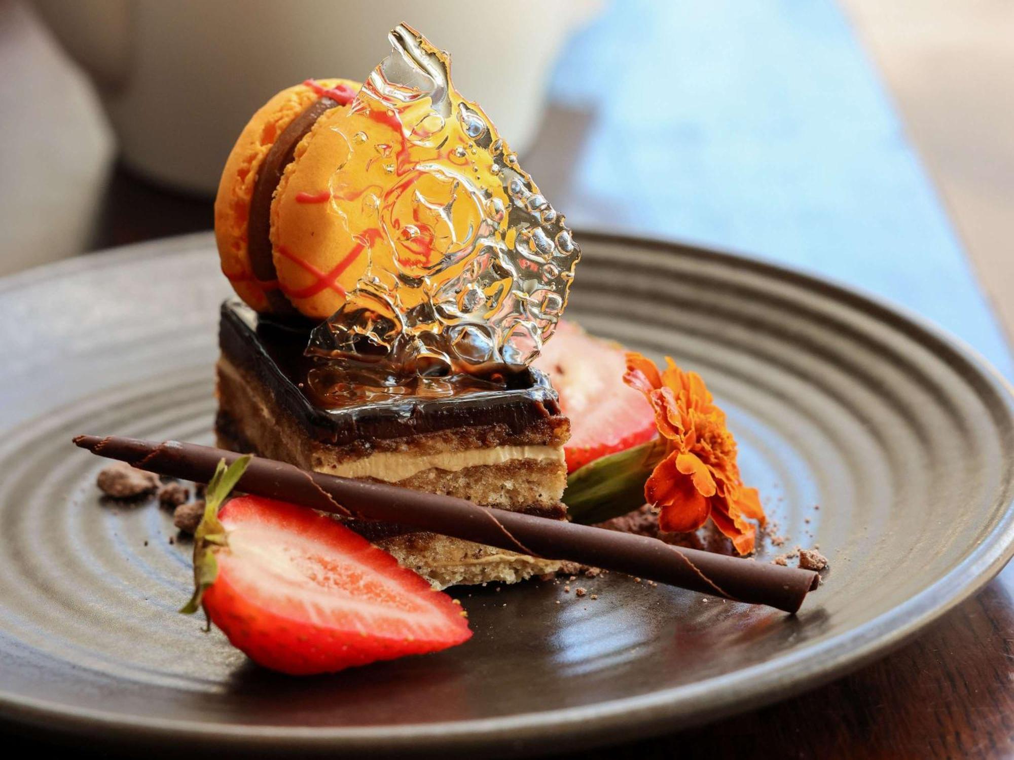 Pullman Sydney Olympic Park Hotel Exterior photo A chocolate cake