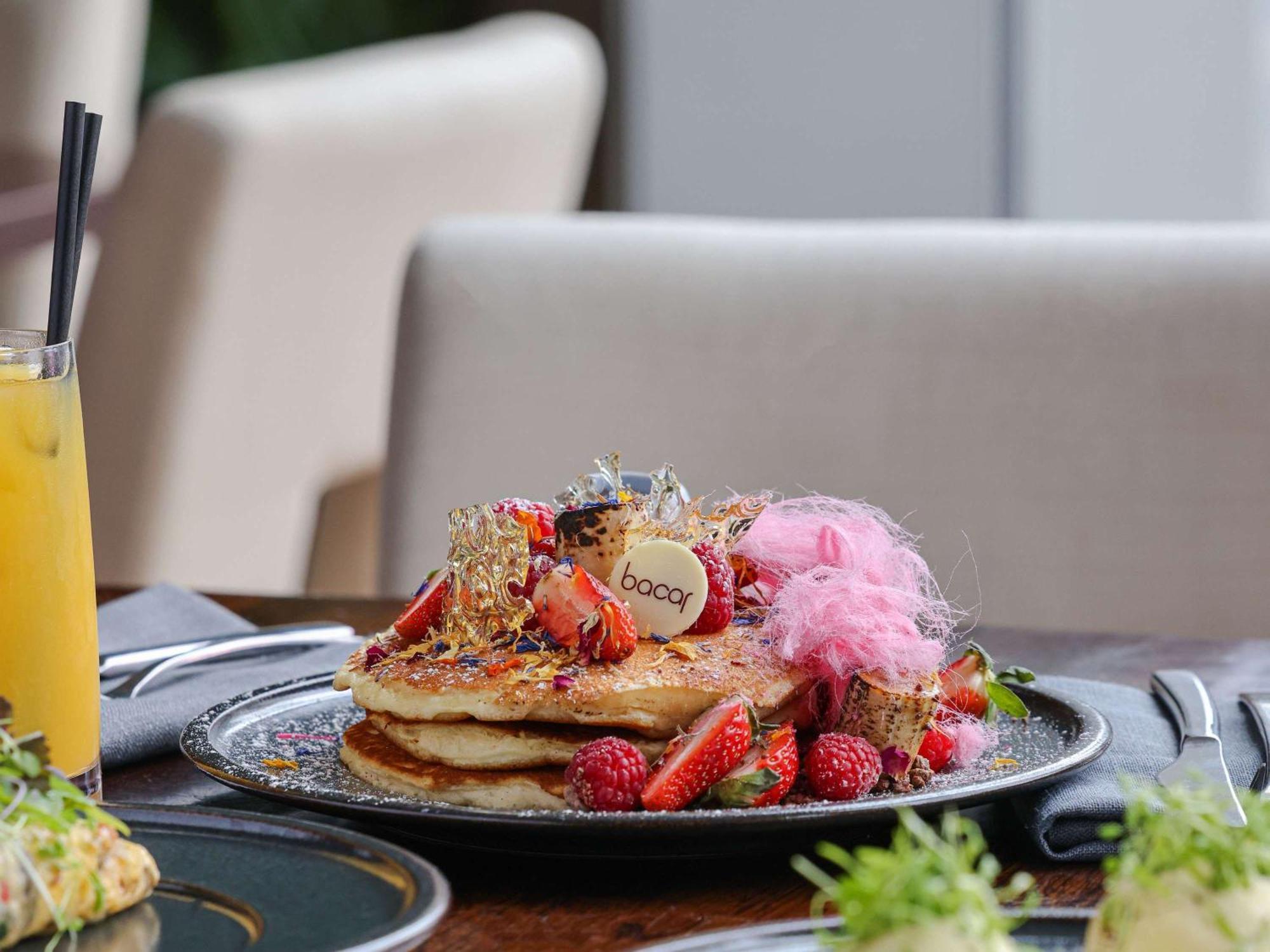 Pullman Sydney Olympic Park Hotel Exterior photo A stack of pancakes with fruit