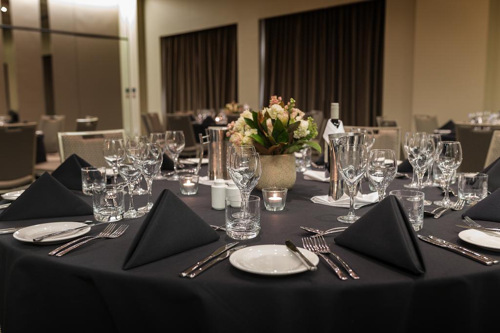 Pullman Sydney Olympic Park Hotel Exterior photo A table set for a formal dinner