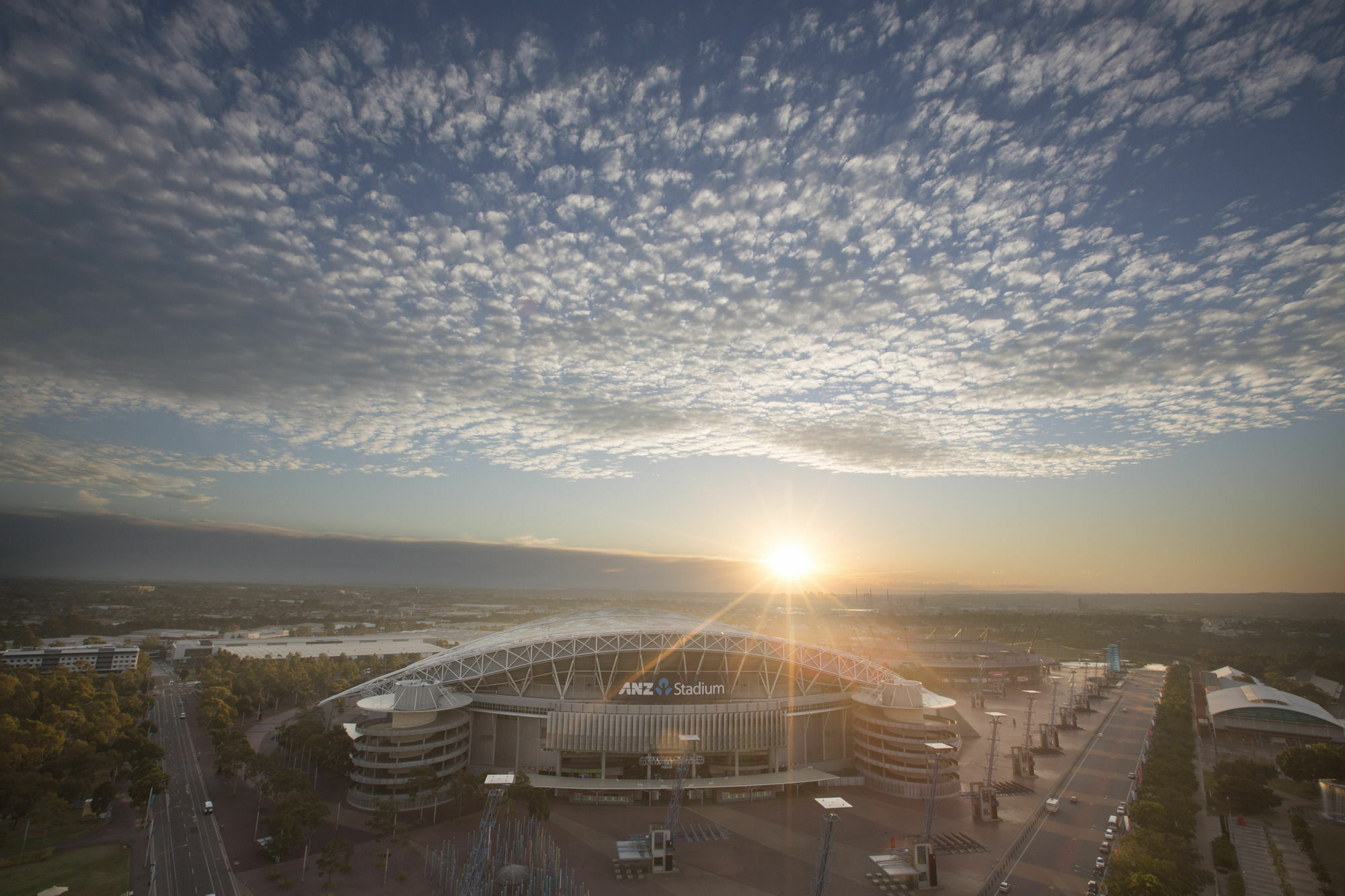 Pullman Sydney Olympic Park Hotel Exterior photo The stadium at sunset